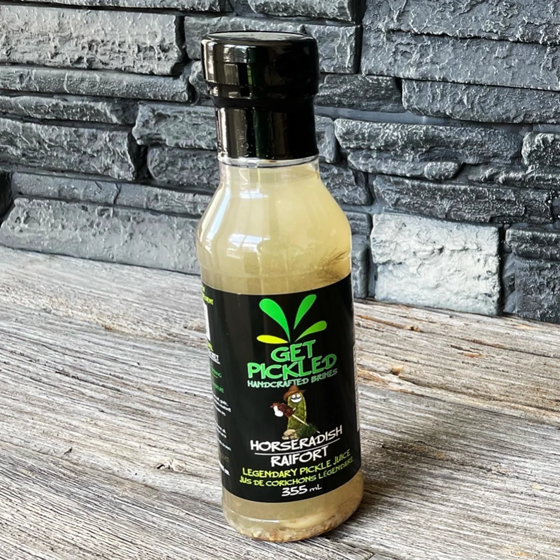 Horseradish Get Pickled brine bottle on a wooden tabletop